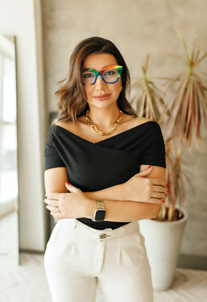 Fashion model wearing VoyueLens Rainbow Cream eyeglasses styled for pastel streetwear and soft statement look.