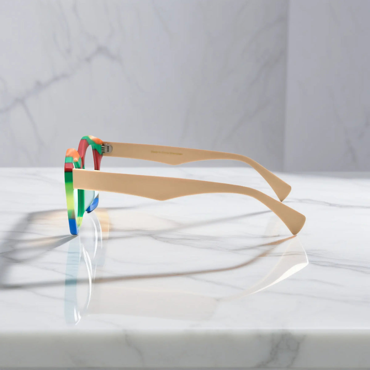 Side view of VoyueLens Rainbow Cream cat-eye frame showing elegant acetate curvature and temple detail.