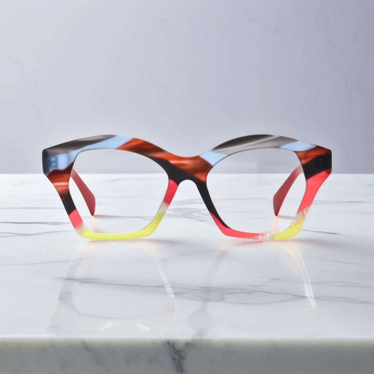 Front view of VoyueLens Rainbow Flame eyeglasses featuring vibrant warm-tone gradient in bold butterfly shape.