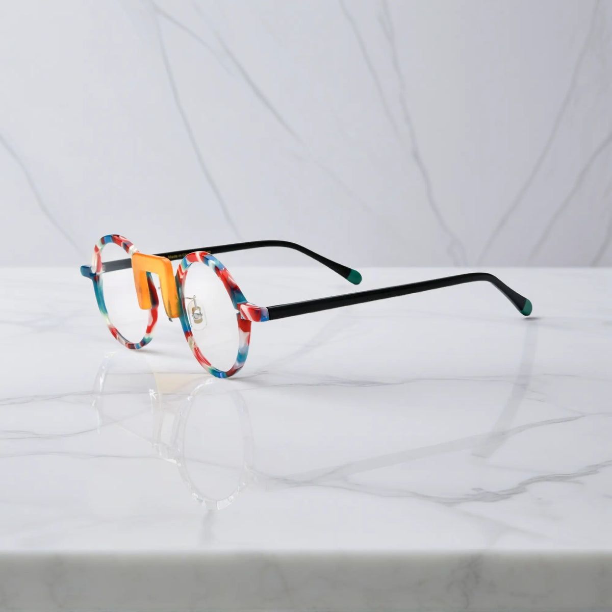 Side profile showing playful, multicolor acetate arms