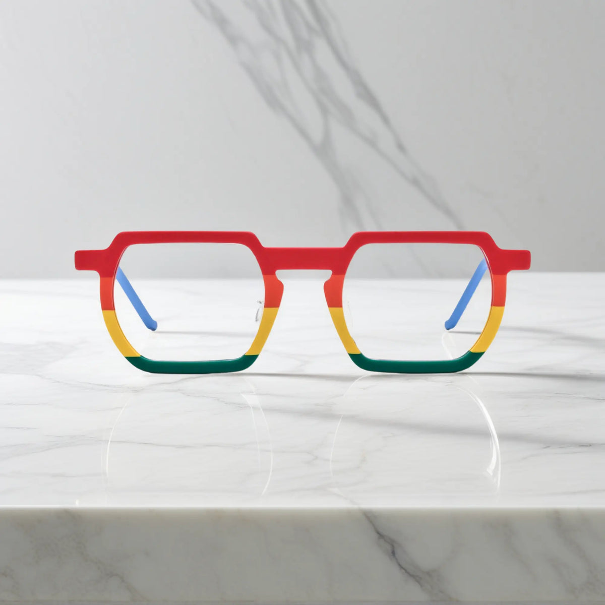 Front view of VoyueLens Rainbow Rush eyeglasses featuring a bold geometric frame and a vibrant rainbow color fade in matte acetate