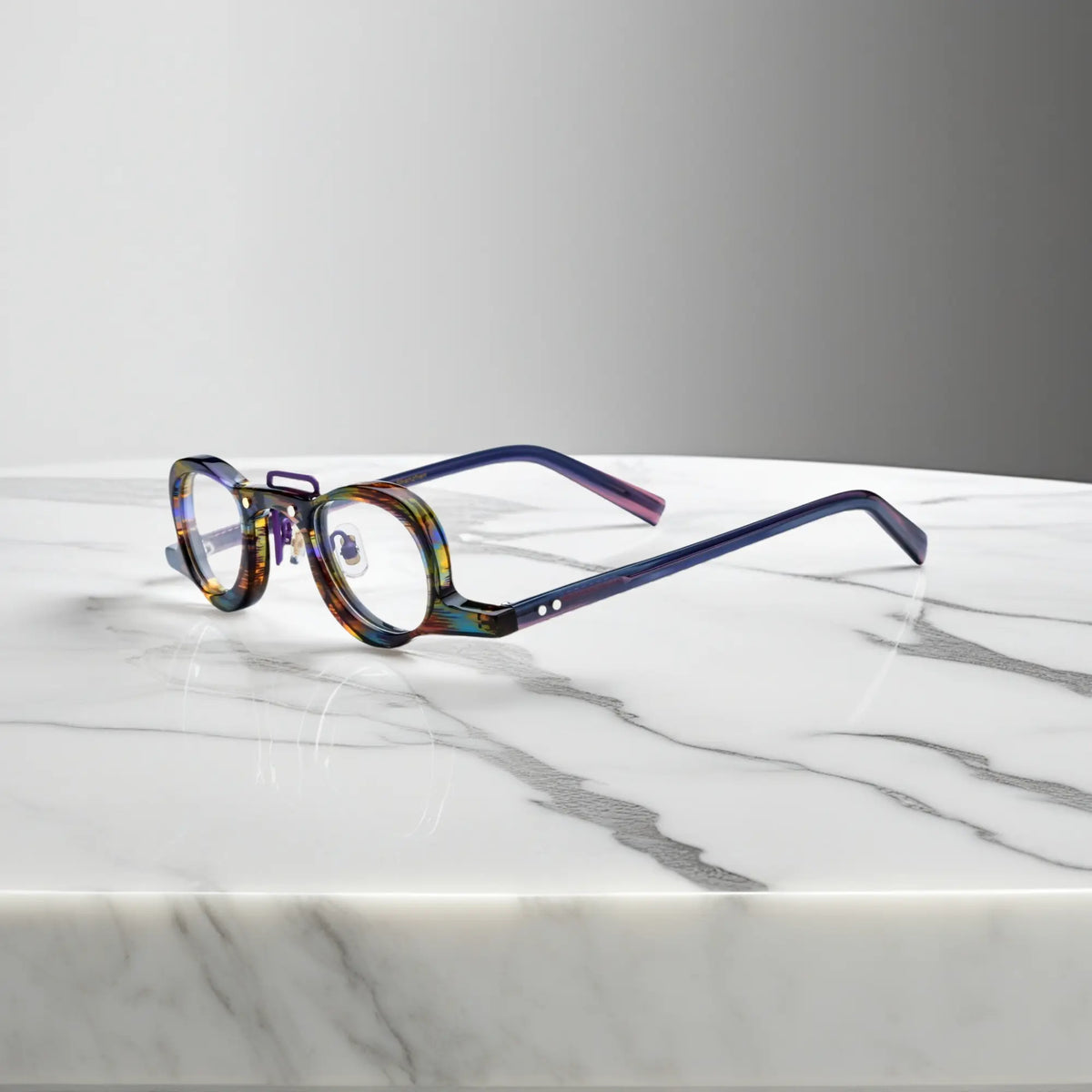 Side profile of VoyueLens Rainbow Tortoise geometric eyeglass frames showing temples and nose pads