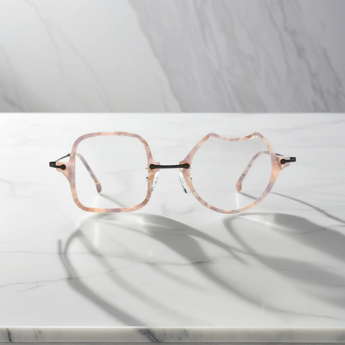 Front View of VoyueLens Shell Pink dual-shaped artistic eyeglasses VL185842-C3. Close-up of the front-facing design showing the asymmetric lens combination with acetate finish.