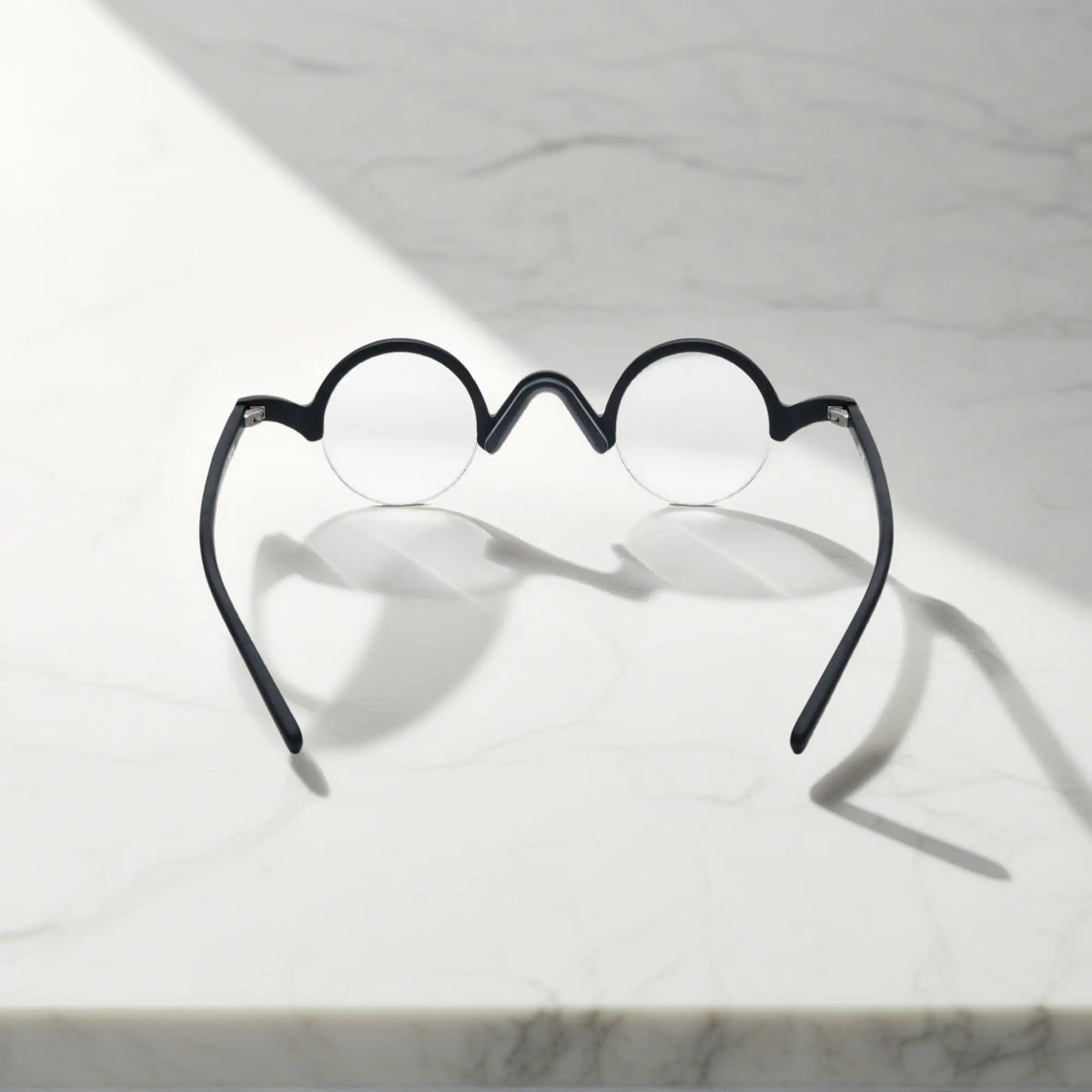 Back view of VoyueLens Solid Black semi-rimless browline eyeglasses showing frame and temple construction.