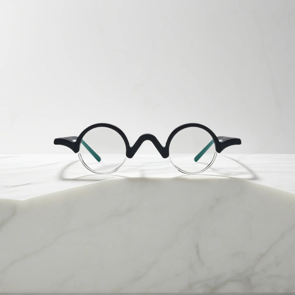 Front facing image of VoyueLens Solid Black semi-rimless browline eyeglasses with minimalistic matte black design.