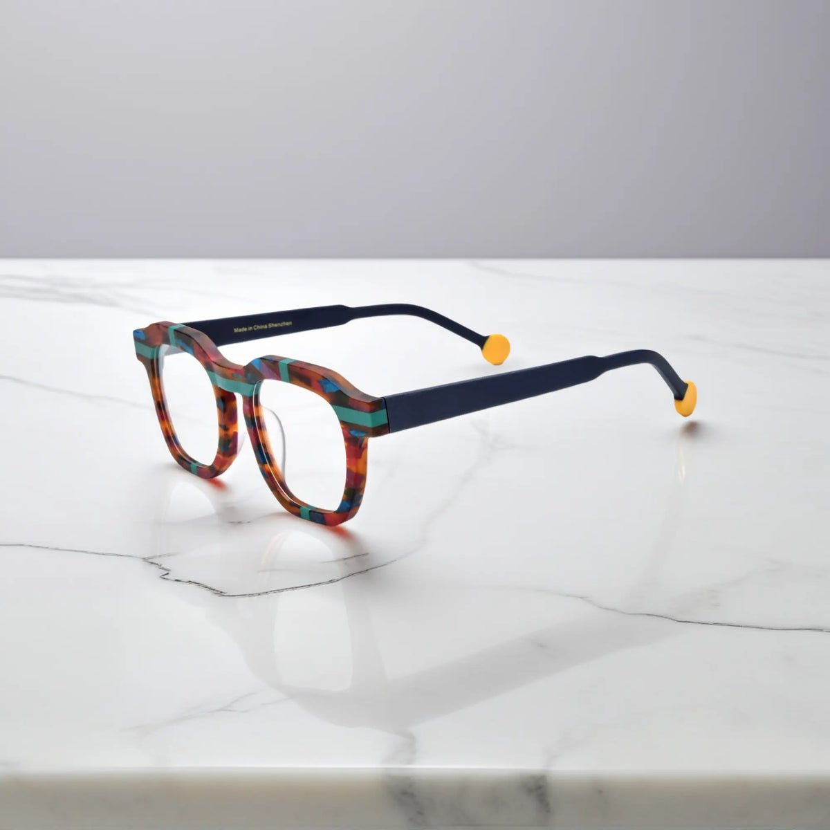 Side view of VoyueLens Tortoiseshell Flash eyeglasses with dark arms and yellow tips