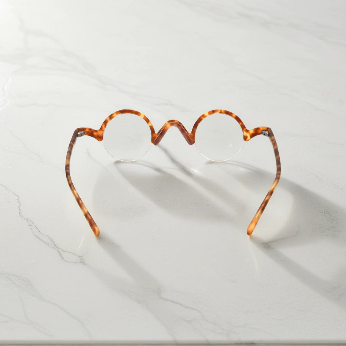 Rear view of VoyueLens Tortoiseshell semi-rimless browline eyeglasses emphasizing durable design.