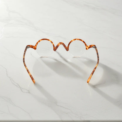 Rear view of VoyueLens Tortoiseshell semi-rimless browline eyeglasses emphasizing durable design.