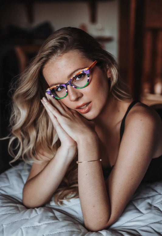 Model wearing VoyueLens KaleidoCat Violet Garden glasses in playful colors