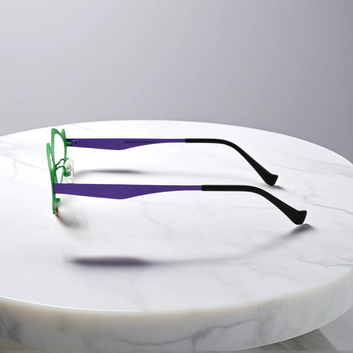 Side profile of VoyueLens VL185811 Violet Green titanium geometric eyeglasses showing temples