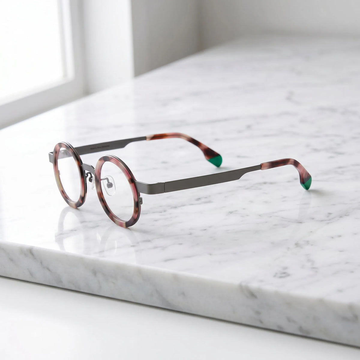 Side profile of Ash Leopard titanium round glasses