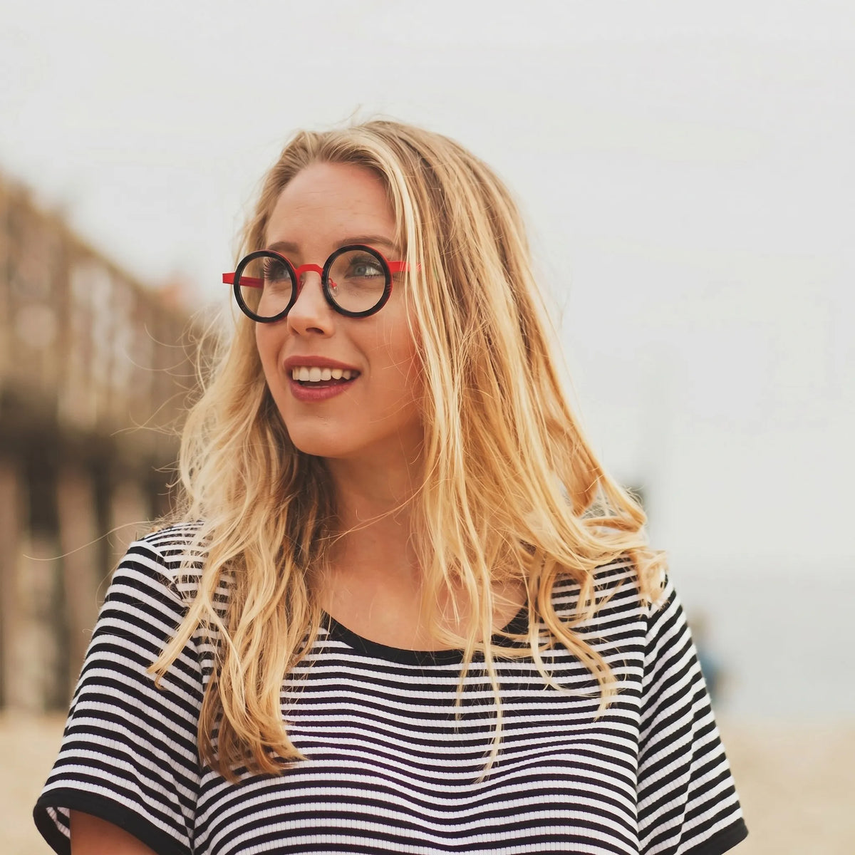 Model showcasing Crimson Tortoise titanium glasses