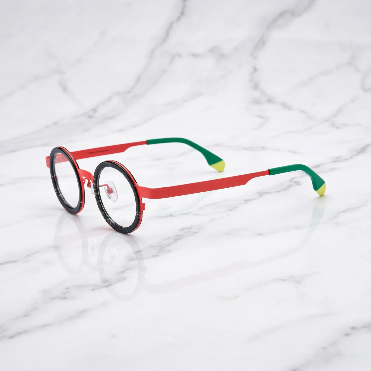 Side view of Crimson Tortoise round titanium glasses
