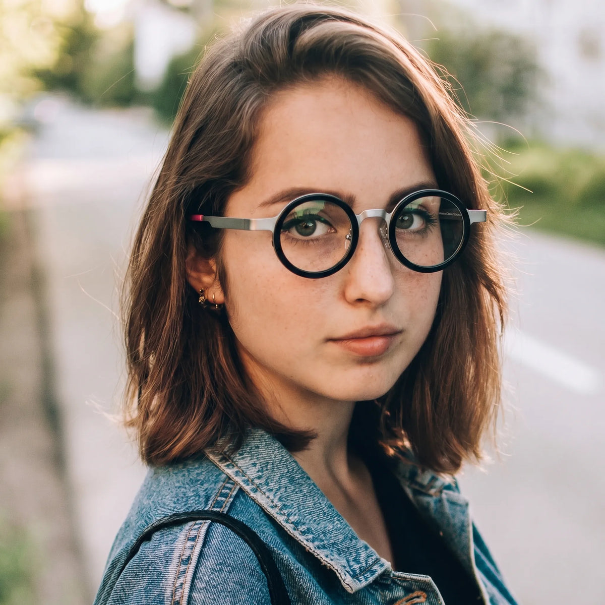 Model wearing Silver Crystal round eyeglasses