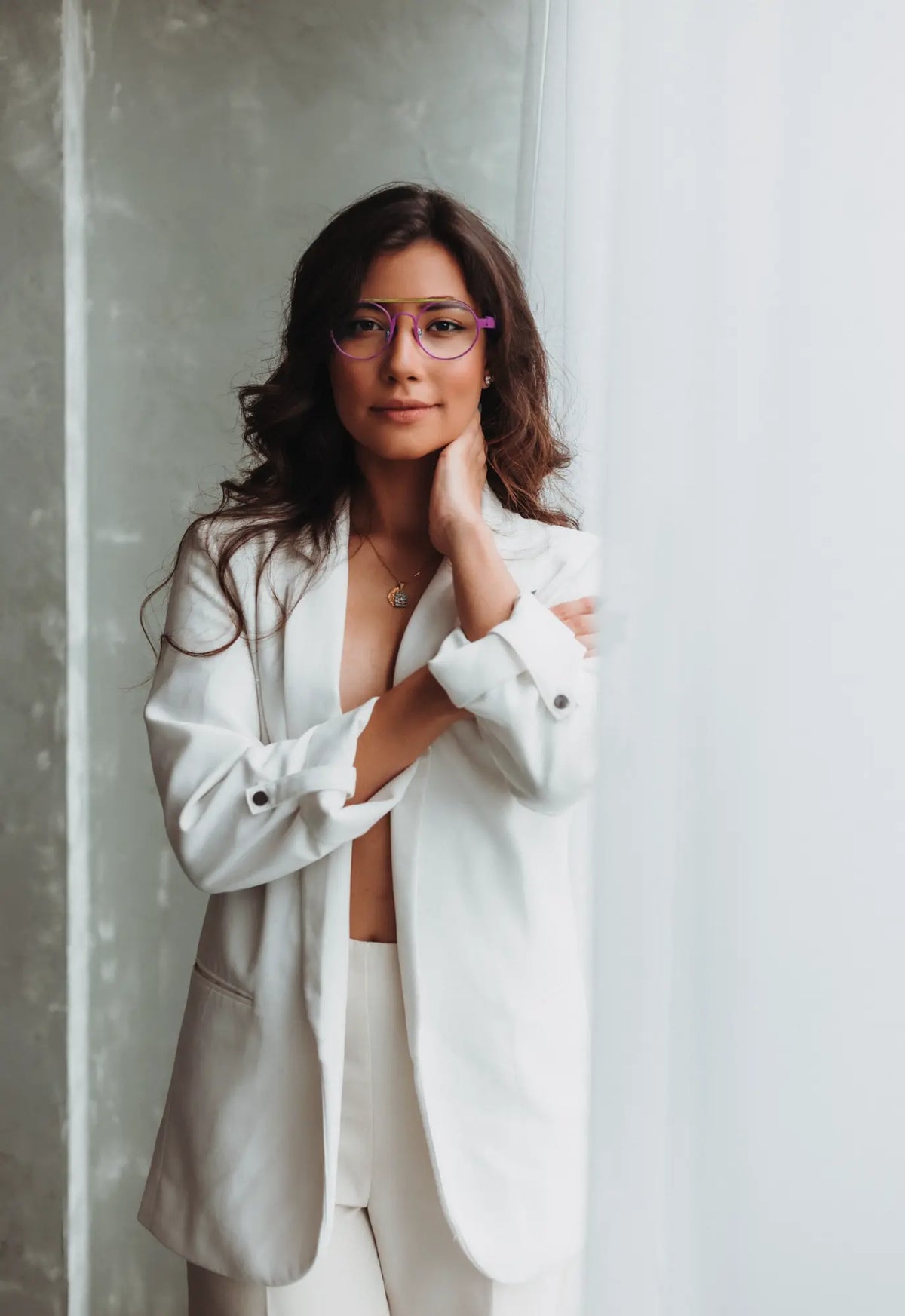Fashion model wearing VoyueLens NeoPilot glasses in Candy Lime color-block titanium frame with pink-green tones, part of the NeoPilot series, highlighting style and fit