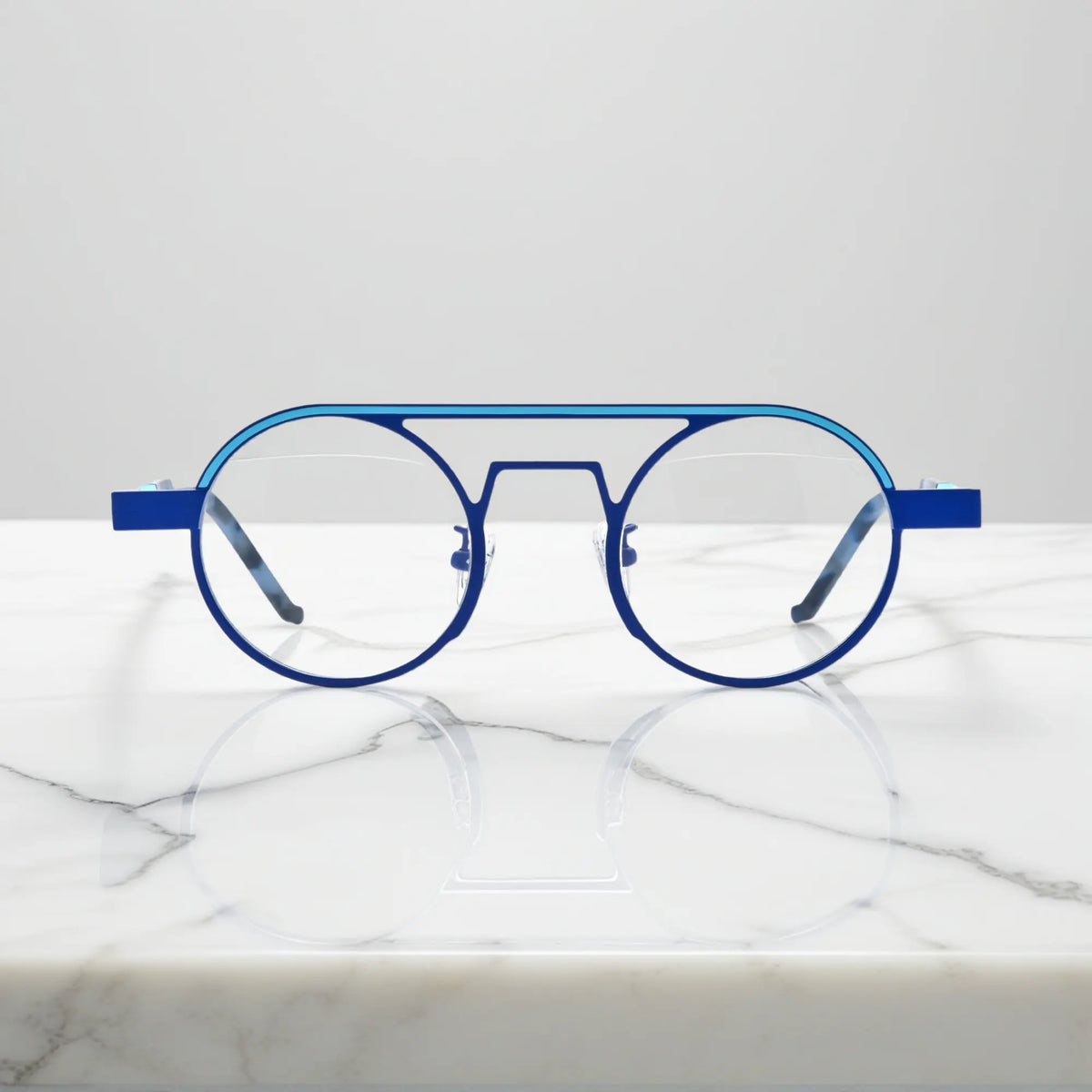 Front view of VoyueLens NeoPilot aviator glasses in Glacier Blue icy titanium aviator frame with a cool, futuristic tone