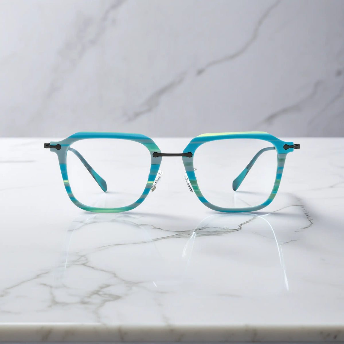 Front angle of Glacier Teal frame with a cool-toned oceanic finish from VoyueLens.
