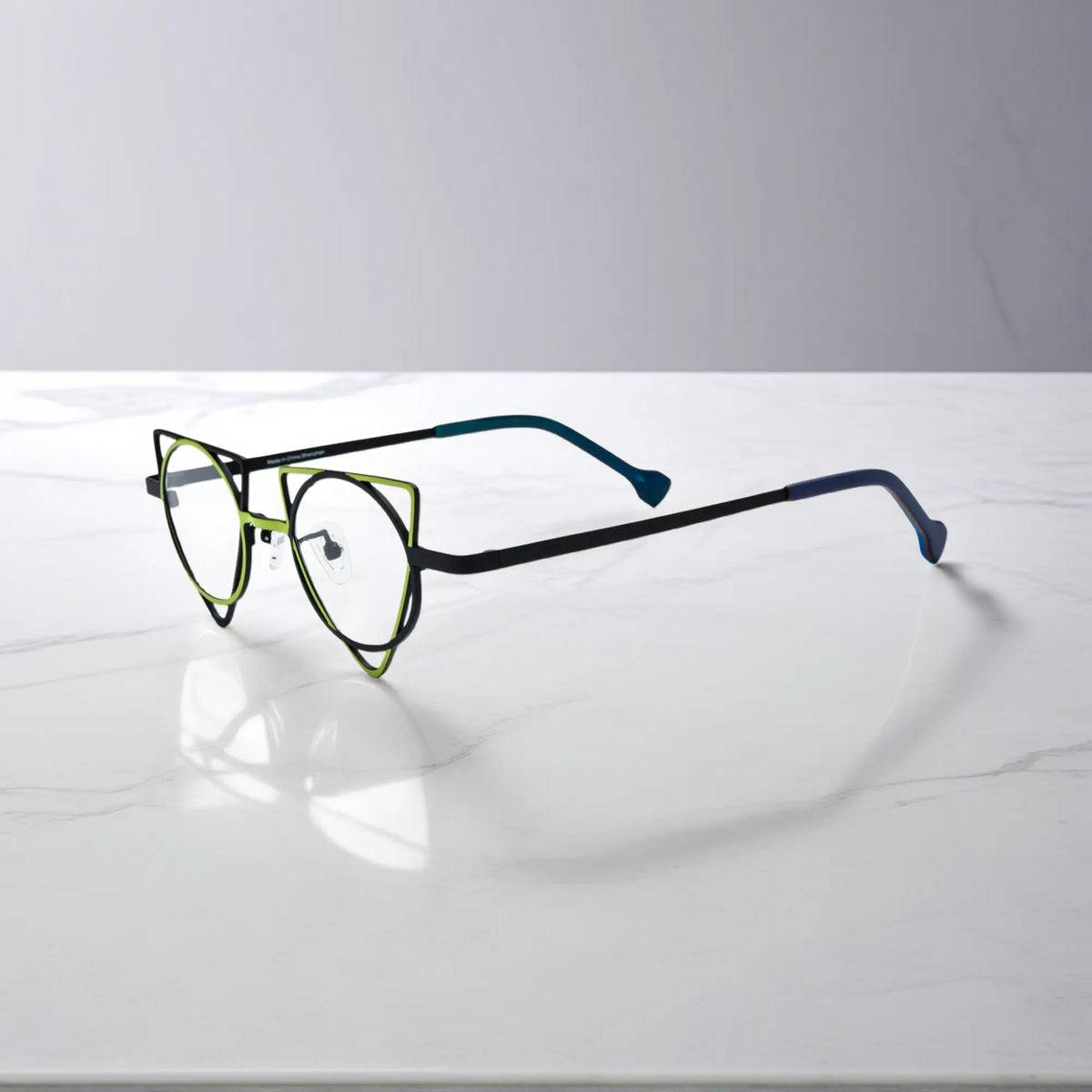 Side profile showing slim titanium temples of VoyueLens Lime Black designer eyeglasses, ideal for modern optical styling