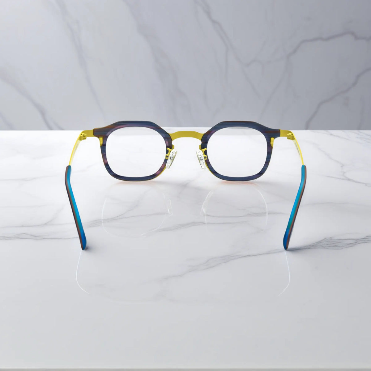 Rear view of VoyueLens Citrus Noir eyeglasses showing a bright yellow front and midnight navy titanium temples.
