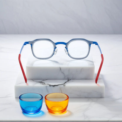 Rear view of VoyueLens Ocean Signal eyeglasses showing a deep blue acetate front and vibrant red titanium temples.