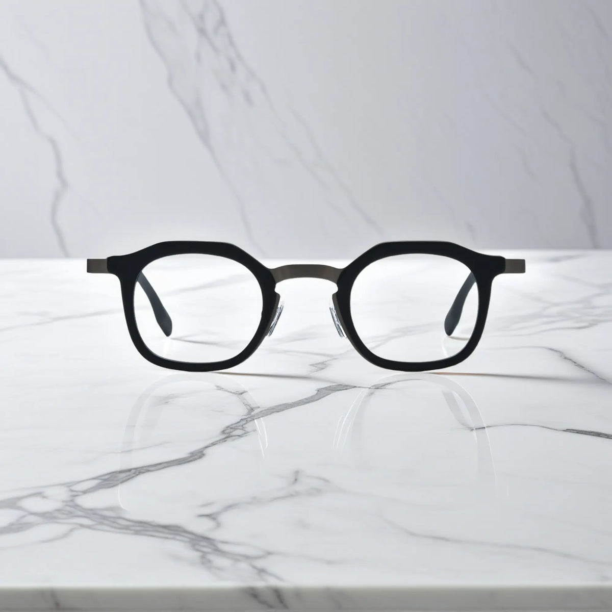 Front view of VoyueLens Graphite Mist square eyeglasses with a matte grey acetate front and black titanium temples.