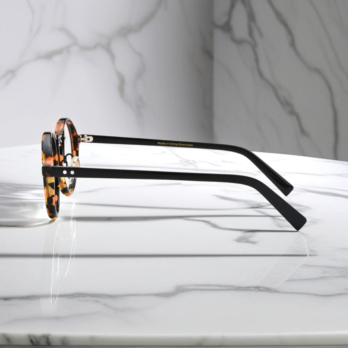 Side view of VoyueLens VL19194-C1 Black Tortoise eyeglasses showing lightweight temple arms and adjustable nose pads and temple flexibility