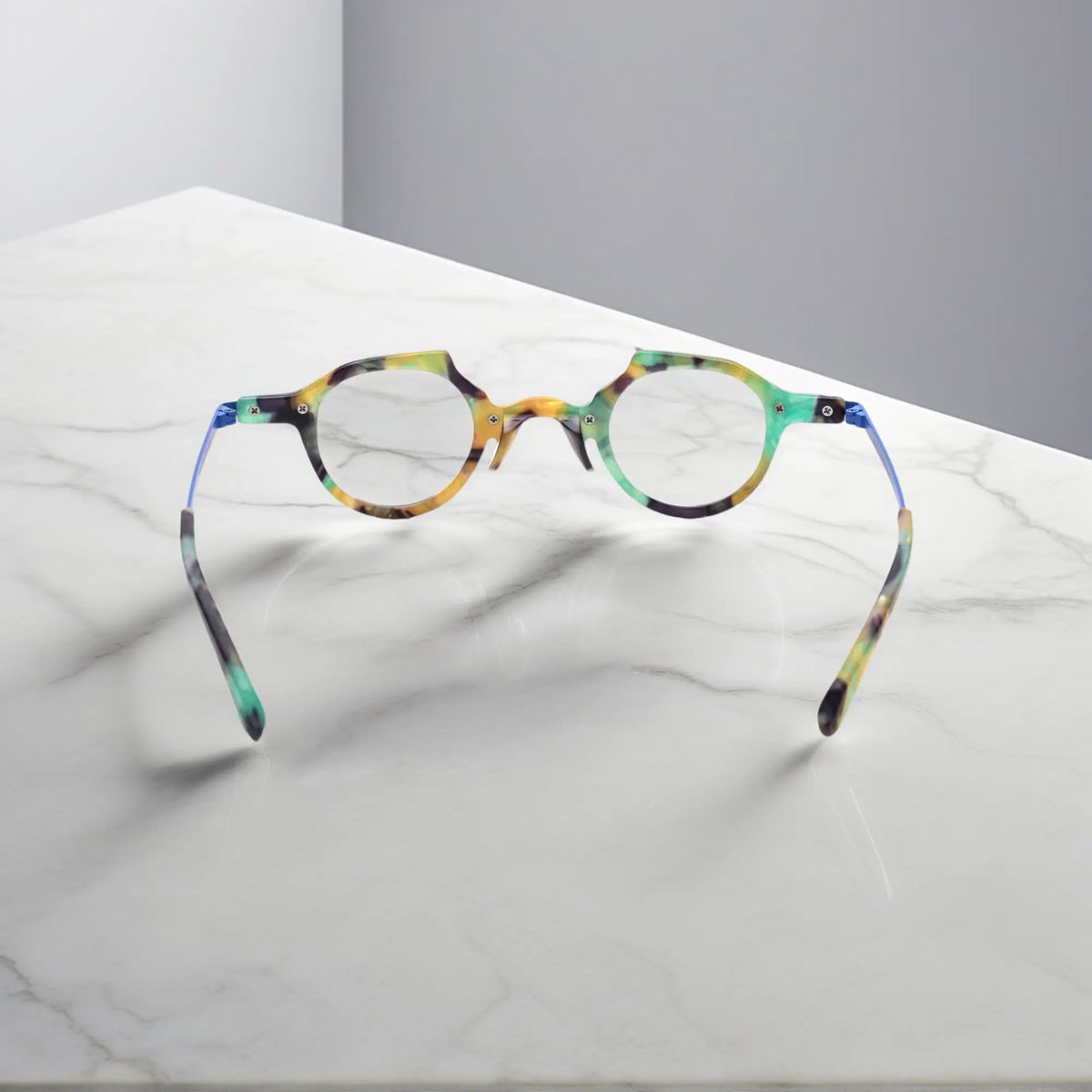 Rear-facing image of VoyueLens VL19341 cobalt blue glasses revealing ergonomic temple design and smooth acetate craftsmanship.