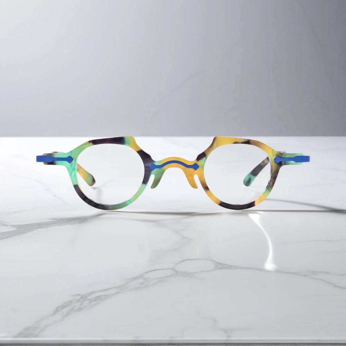 Front view of VoyueLens VL19341 glasses in bold cobalt blue acetate, emphasizing a crisp round frame with glossy surface and stylish presence.