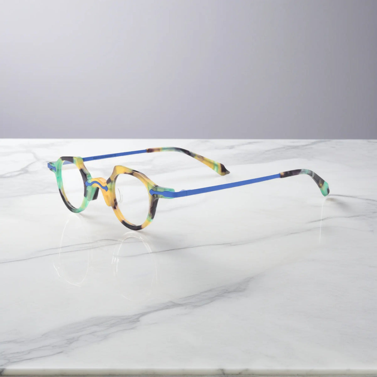 Angled side shot of the VL19341 cobalt blue frame showing ultra-lightweight metal temples and elegant frame curvature for daily comfort.