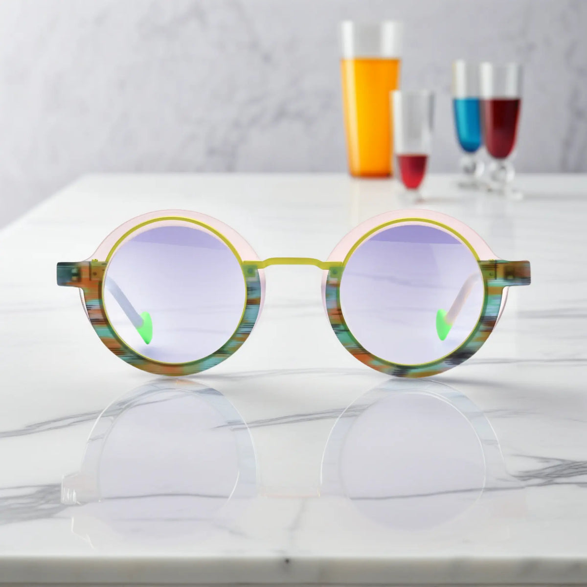 Front view of VoyueLens Chromatic Orbit Eyeglasses in Lilac Bloom showcasing its bold round silhouette and vibrant color scheme.