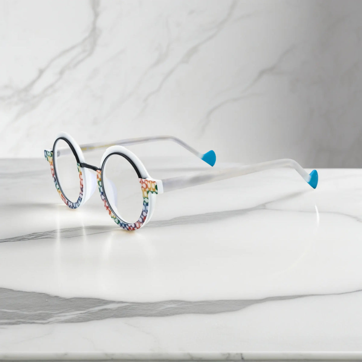 Side angle of VoyueLens eyeglass frames in Mosaic Frost highlighting temple structure and artistic design.