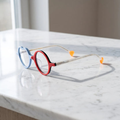 Side view of Ice Blue Cherry variant, showcasing frame thickness and temple arm structure. Cool-toned ice blue paired with a cherry red accent in playful shape.