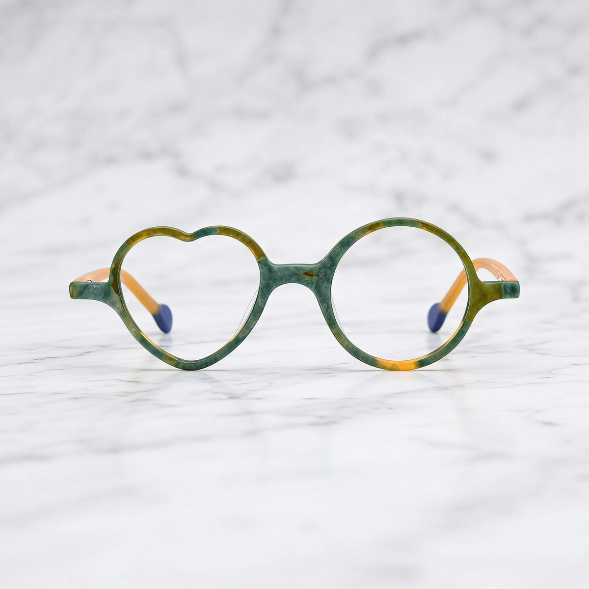 Front view of VoyueLens VL19377 in Citrus Jungle, highlighting heart and round lens design. Lively yellow-green frame inspired by tropical citrus and foliage.