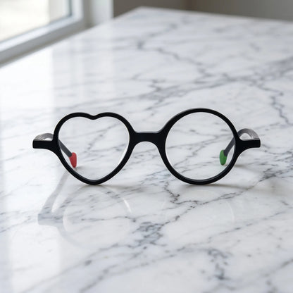 Front view of VoyueLens VL19377 in Charcoal Dusk, highlighting heart and round lens design. Minimalist all-black frame with subtle matte texture and modern shape.