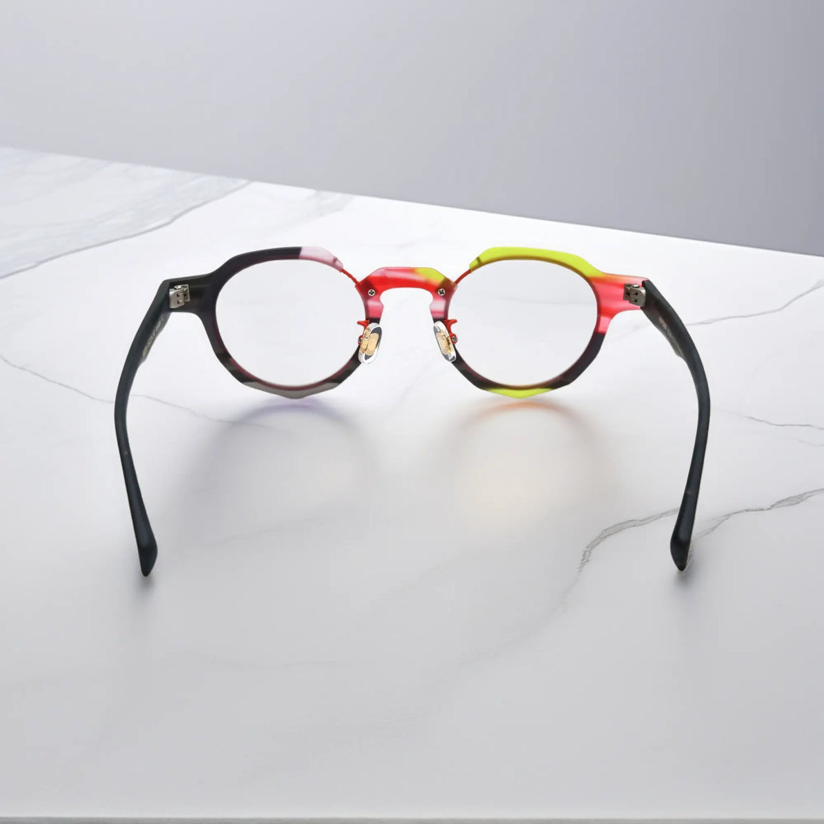 Rear angle of VoyueLens Midnight Flame eyeglasses with stylish red-black layering