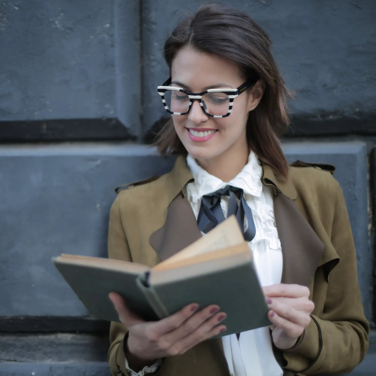 Model wearing VoyueLens Zebra Noir eyeglasses in Zebra Noir – black and white striped color block design